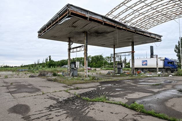 RECORD DATE NOT STATED A gas station destroyed during hostilities is seen along the Mykolaiv–Kherson highway, Ukraine, on June 3, 2026. The Russian army attacks Kherson and the surrounding region daily with FPV drones and other unmanned aerial vehicles, deliberately terrorizing civilians. Russian forces conduct hunts for local residents, tracking them with FPV drones and dropping explosives. Police officers, medics, public transport, and civilian infrastructure are also targeted. Based on the intensity of attacks, Kherson is informally divided into yellow and red zones, with the red zone considered the most dangerous due to constant shelling and drone strikes (Photo by Dmytro Smolienko Ukrinform) Life under shelling in frontline Kherson  Copyright: xDmytroxSmolienkox