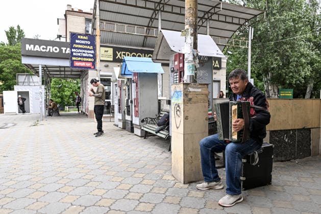 RECORD DATE NOT STATED A man plays an accordion in the red zone of the frontline city of Kherson, the area considered the most dangerous due to constant Russian attacks, Kherson, Ukraine, on June 3, 2026. The Russian army attacks the city daily with FPV drones and other unmanned aerial vehicles, deliberately terrorizing civilians. Russian forces conduct hunts for local residents, tracking them with FPV drones and dropping explosives. Police officers, medics, public transport, and urban infrastructure are also targeted. Based on the intensity of attacks, Kherson is informally divided into yellow and red zones, with the red zone subjected to continuous shelling and drone strikes (Photo by Dmytro Smolienko Ukrinform) Life under shelling in frontline Kherso  Copyright: xDmytroxSmolienkox