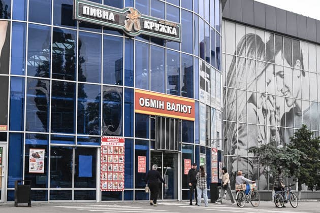 RECORD DATE NOT STATED Residents of frontline Kherson stand near a supermarket in the city’s yellow zone, Kherson, Ukraine, on June 3, 2026. The Russian army attacks the city daily with FPV drones and other unmanned aerial vehicles, deliberately terrorizing civilians. Russian forces conduct hunts for local residents, tracking them with FPV drones and dropping explosives. Police officers, medics, public transport, and urban infrastructure are also targeted. Based on the intensity of attacks, Kherson is informally divided into yellow and red zones, with the red zone considered the most dangerous due to constant shelling and drone strikes (Photo by Dmytro Smolienko Ukrinform) Life under shelling in frontline Kherson  Copyright: xDmytroxSmolienkox