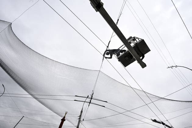 RECORD DATE NOT STATED A municipal worker installs anti-drone netting to protect against Russian FPV drones in the yellow zone of the frontline city of Kherson, Ukraine, on June 3, 2026. The Russian army attacks the city daily with FPV drones and other unmanned aerial vehicles, deliberately terrorizing civilians. Russian forces conduct hunts for local residents, tracking them with FPV drones and dropping explosives. Police officers, medics, public transport, and urban infrastructure are also targeted. Based on the intensity of attacks, Kherson is informally divided into yellow and red zones, with the red zone being the most dangerous due to constant shelling and drone strikes (Photo by Dmytro Smolienko Ukrinform) Life under shelling in frontline Kherson  Copyright: xDmytroxSmolienkox