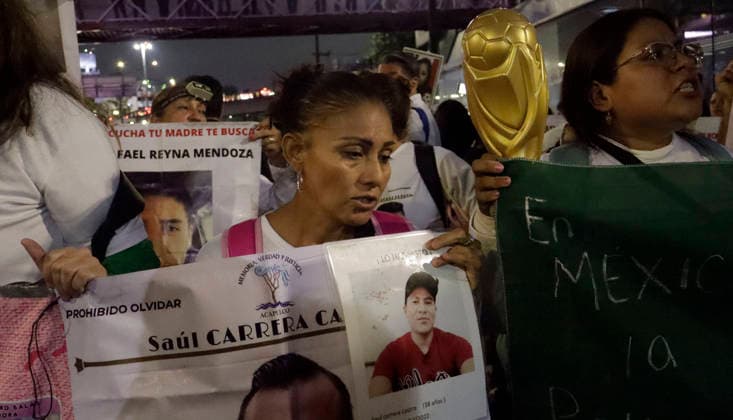 June 10, 2026, Mexico City, Mexico City, mexico: A mother carries a missing-person flyer of her relative during a march to Banorte Stadium. Mexico City mexico - ZUMAt178 20260610_zip_t178_025 Copyright: xNadiaxTecuapetlax