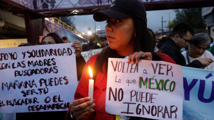 June 10, 2026, Mexico City, Mexico City, mexico: A participant in the march for the missing lights the way to Banorte Stadium. Mexico City mexico - ZUMAt178 20260610_zip_t178_019 Copyright: xNadiaxTecuapetlax