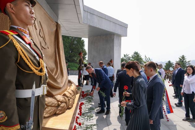 NORTH KOREA, PYONGYANG - JUNE 11, 2026: Staff members of Russian institutions attend a wreath laying ceremony at the Liberation Monument marking the upcoming Russia Day. Stanislav Varivoda TASS  93653379