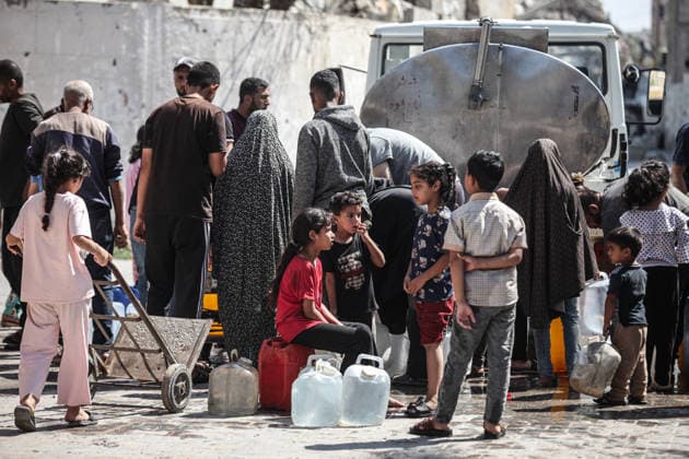 Displaced Palestinians queue for water in central Gaza Displaced Palestinians gather to collect drinking water and water for daily use from a mobile distribution truck in the Bureij refugee camp in the central Gaza Strip on June 11, 2026. Palestinians in Gaza face a severe shortage of drinking and household water as wells and water facilities remain disrupted due to shortages of fuel and spare parts, forcing residents to wait for hours and travel long distances to obtain limited supplies amid rising temperatures and increased demand during the summer season. Photo by Moiz Salhi apaimages Nusairat Gaza Strip Palestinian Territory 110626_Bureij_MS_00(18) Copyright: xapaimagesxMoizxSalhixx xapaimagesx