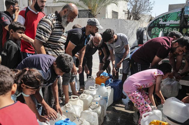 Displaced Palestinians queue for water in central Gaza Displaced Palestinians gather to collect drinking water and water for daily use from a mobile distribution truck in the Bureij refugee camp in the central Gaza Strip on June 11, 2026. Palestinians in Gaza face a severe shortage of drinking and household water as wells and water facilities remain disrupted due to shortages of fuel and spare parts, forcing residents to wait for hours and travel long distances to obtain limited supplies amid rising temperatures and increased demand during the summer season. Photo by Moiz Salhi apaimages Nusairat Gaza Strip Palestinian Territory 110626_Bureij_MS_00(2) Copyright: xapaimagesxMoizxSalhixx xapaimagesx