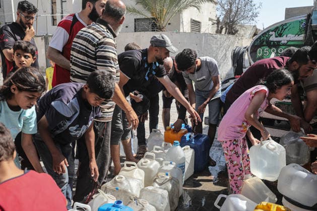 Displaced Palestinians queue for water in central Gaza Displaced Palestinians gather to collect drinking water and water for daily use from a mobile distribution truck in the Bureij refugee camp in the central Gaza Strip on June 11, 2026. Palestinians in Gaza face a severe shortage of drinking and household water as wells and water facilities remain disrupted due to shortages of fuel and spare parts, forcing residents to wait for hours and travel long distances to obtain limited supplies amid rising temperatures and increased demand during the summer season. Photo by Moiz Salhi apaimages Nusairat Gaza Strip Palestinian Territory 110626_Bureij_MS_00(3) Copyright: xapaimagesxMoizxSalhixx xapaimagesx