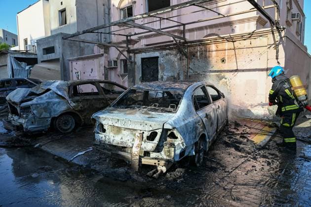 (260611) -- HAMAD, June 11, 2026 -- A member of Bahrain s Civil Defense extinguishes a fire caused by falling debris from intercepted Iranian drones in Hamad Town, Bahrain, on June 11, 2026. An 11-year-old girl sustained minor injuries after debris from intercepted Iranian drones fell in Bahrain, damaging some houses, said Thursday. Iran s Islamic Revolution Guard Corps said Thursday it had launched attacks on U.S. military bases in Jordan, Kuwait and Bahrain in retaliation for U.S. strikes. ( Handout via Xinhua) BAHRAIN-IRANIAN ATTACK-INTERCEPTION-AFTERMATH Bahrain sxInteriorxMinistry 