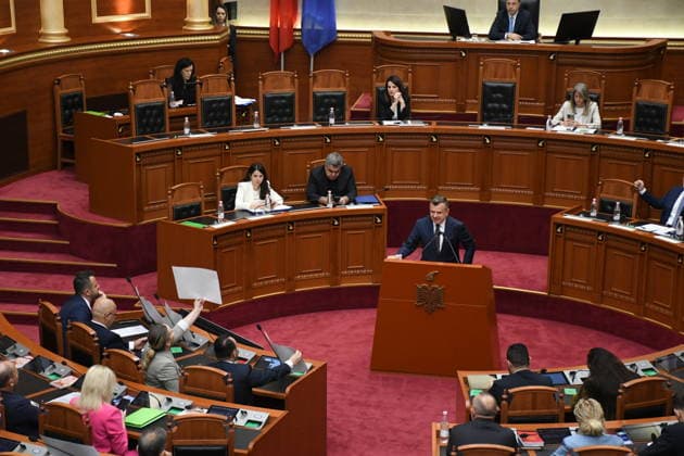 Albanian lawmakers discuss disputed tourism project in Vlora TIRANA, ALBANIA - JUNE 11: Albanian lawmakers attend a parliamentary session in Tirana, Albania, on June 11, 2026. The Albanian Parliament convened to discuss a controversial tourism project planned for the Zvernec area of the coastal city of Vlora. Environment Minister Sofjan Jaupaj answered questions submitted by opposition Democratic Party (PD) lawmakers regarding the project, which has sparked demonstrations across the country. Olsi Shehu Anadolu Tirana Albania. Editorial use only. Please get in touch for any other usage.  Copyright: x2026xAnadoluxOlsixShehux
