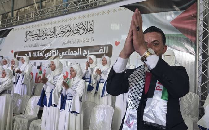 Mass wedding brings hope to displaced couples in Gaza Palestinian brides and grooms take part in the collective wedding ceremony Window of Hope in Khan Younis, southern Gaza Strip, on June 11, 2026. The event brought together dozens of displaced couples from the town of Khuza a, east of Khan Younis, as part of an initiative aimed at supporting newlyweds, easing social and economic burdens, and highlighting the community’s efforts to preserve moments of joy despite ongoing hardship. Photo by Tariq Mohammad APA Images Khan Yunis Gaza Strip Palestinian Territory 110626_Khan_Yunis_TM_01(15) Copyright: xapaimagesxTariqxMohammad xapaimagesx