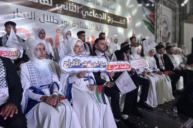 Mass wedding brings hope to displaced couples in Gaza Palestinian brides and grooms take part in the collective wedding ceremony Window of Hope in Khan Younis, southern Gaza Strip, on June 11, 2026. The event brought together dozens of displaced couples from the town of Khuza a, east of Khan Younis, as part of an initiative aimed at supporting newlyweds, easing social and economic burdens, and highlighting the community’s efforts to preserve moments of joy despite ongoing hardship. Photo by Tariq Mohammad APA Images Khan Yunis Gaza Strip Palestinian Territory 110626_Khan_Yunis_TM_01(19) Copyright: xapaimagesxTariqxMohammad xapaimagesx