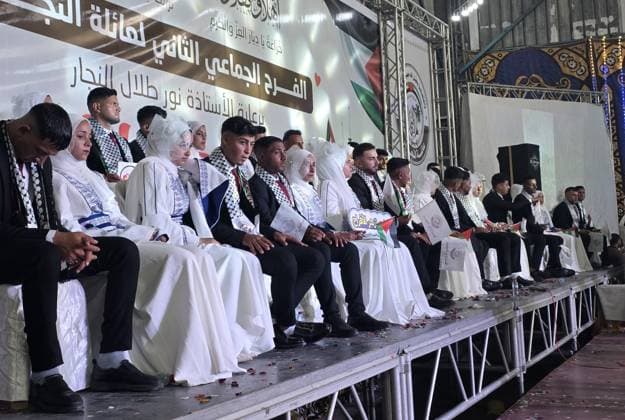 Mass wedding brings hope to displaced couples in Gaza Palestinian brides and grooms take part in the collective wedding ceremony Window of Hope in Khan Younis, southern Gaza Strip, on June 11, 2026. The event brought together dozens of displaced couples from the town of Khuza a, east of Khan Younis, as part of an initiative aimed at supporting newlyweds, easing social and economic burdens, and highlighting the community’s efforts to preserve moments of joy despite ongoing hardship. Photo by Tariq Mohammad APA Images Khan Yunis Gaza Strip Palestinian Territory 110626_Khan_Yunis_TM_01(20) Copyright: xapaimagesxTariqxMohammad xapaimagesx