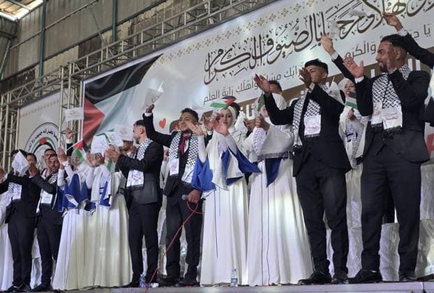 Mass wedding brings hope to displaced couples in Gaza Palestinian brides and grooms take part in the collective wedding ceremony Window of Hope in Khan Younis, southern Gaza Strip, on June 11, 2026. The event brought together dozens of displaced couples from the town of Khuza a, east of Khan Younis, as part of an initiative aimed at supporting newlyweds, easing social and economic burdens, and highlighting the community’s efforts to preserve moments of joy despite ongoing hardship. Photo by Tariq Mohammad APA Images Khan Yunis Gaza Strip Palestinian Territory 110626_Khan_Yunis_TM_01(10) Copyright: xapaimagesxTariqxMohammad xapaimagesx