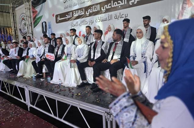 Mass wedding brings hope to displaced couples in Gaza Palestinian brides and grooms take part in the collective wedding ceremony Window of Hope in Khan Younis, southern Gaza Strip, on June 11, 2026. The event brought together dozens of displaced couples from the town of Khuza a, east of Khan Younis, as part of an initiative aimed at supporting newlyweds, easing social and economic burdens, and highlighting the community’s efforts to preserve moments of joy despite ongoing hardship. Photo by Tariq Mohammad APA Images Khan Yunis Gaza Strip Palestinian Territory 110626_Khan_Yunis_TM_01(11) Copyright: xapaimagesxTariqxMohammad xapaimagesx