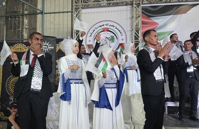 Mass wedding brings hope to displaced couples in Gaza Palestinian brides and grooms take part in the collective wedding ceremony Window of Hope in Khan Younis, southern Gaza Strip, on June 11, 2026. The event brought together dozens of displaced couples from the town of Khuza a, east of Khan Younis, as part of an initiative aimed at supporting newlyweds, easing social and economic burdens, and highlighting the community’s efforts to preserve moments of joy despite ongoing hardship. Photo by Tariq Mohammad APA Images Khan Yunis Gaza Strip Palestinian Territory 110626_Khan_Yunis_TM_01(4) Copyright: xapaimagesxTariqxMohammad xapaimagesx