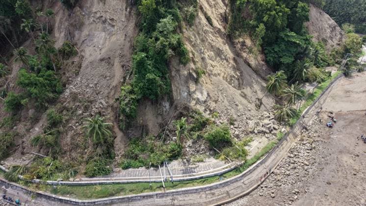 (260611) -- GENERAL SANTOS CITY, June 11, 2026 -- This photo taken on June 11, 2026 shows a blocked road after a major landslide triggered by an earthquake, in Sarangani Province, the Philippines. At least 47 people were killed, 31 missing and 688 injured after a magnitude 7.8 earthquake struck off the southern coast of Mindanao, the Philippines, on Monday, said the National Disaster Risk Reduction and Management Council (NDRRMC) on Thursday. (Str Xinhua) PHILIPPINES-SARANGANI PROVINCE-EARTHQUAKE-AFTERMATH RouellexUmali 