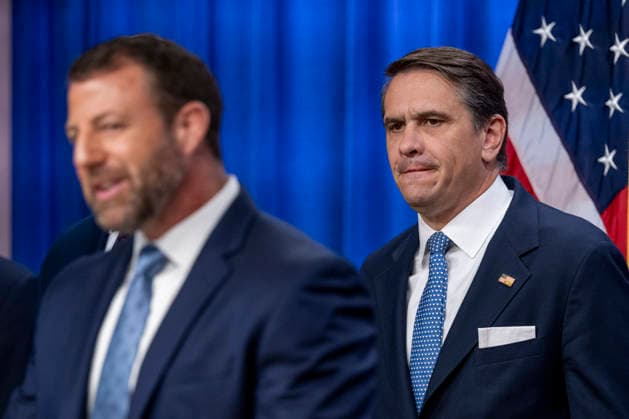 (L-R) Acting Attorney General Todd Blanche listens as Secretary of the Department of Homeland Security Markwayne Mullin speaks during a press conference at the Department of Justice in Washington, DC on Thursday, June 11, 2026. The leaders announced the government s effort to locate and safeguard unaccompanied alien children (UAC), or children under age 18 who lack both lawful immigration status in the United States, and a parent or legal guardian in the United States.  WAP202606111149 DANIELxHEUER