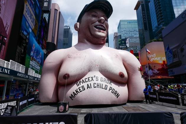 New York, NY- June 11th: A Giant Inflatable Sculpture of Elon Musk in Times Square Manhattan on June 11, displays the statement Ã¢â‚¬oeSpace XÃ¢â‚¬â ¢s Grok Makes AI Child PornÃ¢â‚¬Â.on June 11, 2026 Credit: Camara Porter USA - ZUMAa123 20260611_zaa_a123_002 Copyright: xAdMediax