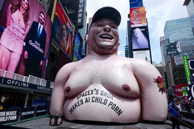 New York, NY- June 11th: A Giant Inflatable Sculpture of Elon Musk in Times Square Manhattan on June 11, displays the statement Ã¢â‚¬oeSpace XÃ¢â‚¬â ¢s Grok Makes AI Child PornÃ¢â‚¬Â.on June 11, 2026 Credit: Camara Porter USA  - ZUMAa123 20260611_zaa_a123_006 Copyright: xAdMediax
