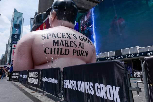 New York, NY- June 11th: A Giant Inflatable Sculpture of Elon Musk in Times Square Manhattan on June 11, displays the statement Ã¢â‚¬oeSpace XÃ¢â‚¬â ¢s Grok Makes AI Child PornÃ¢â‚¬Â.on June 11, 2026 Credit: Camara Porter USA - ZUMAa123 20260611_zaa_a123_004 Copyright: xAdMediax