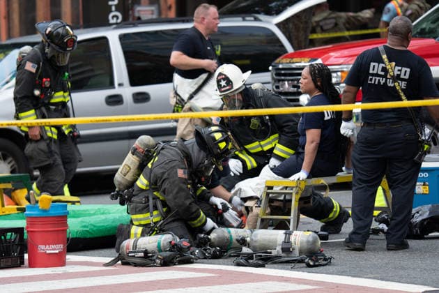 June 11, 2026, Washington, Dc, United States: Washington, D.C. fire fighters are decontaminated following a suspcious package incident near the Foggy Bottom Metro station in Washington, D.C. on June 11, 2026. Washington United States  - ZUMAl312 20260611_znp_l312_048 Copyright: xAndrewxLeydenx