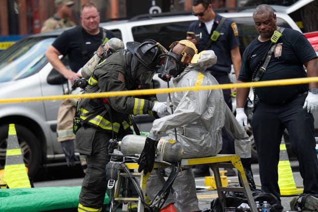 June 11, 2026, Washington, Dc, United States: Washington, D.C. fire fighters are decontaminated following a suspcious package incident near the Foggy Bottom Metro station in Washington, D.C. on June 11, 2026. Washington United States - ZUMAl312 20260611_znp_l312_047 Copyright: xAndrewxLeydenx