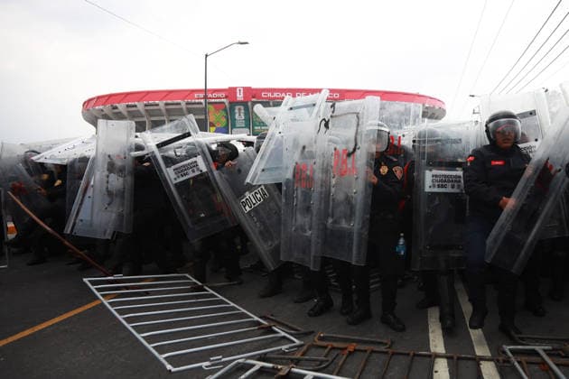 Demonstrators clash with police during the World Cup opener in Mexico City MEXICO CITY, MEXICO - JUNE 11: Riot police use shields to protect themselves during clashes with demonstrators near Banorte Stadium, in Mexico City, Mexico on June 11, 2026. Thousands of demonstrators marched toward Banorte Stadium to protest against the World Cup, while some clashed with riot police outside the stadium where the World Cup opener was taking place. Daniel Cardenas Anadolu Mexico City Mexico. Editorial use only. Please get in touch for any other usage.  Copyright: x2026xAnadoluxDanielxCardenasx