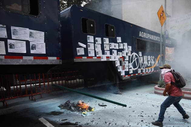 Demonstrators clash with police during the World Cup opener in Mexico City MEXICO CITY, MEXICO - JUNE 11: Smoke and flames rise from the burning materials during a protest against the World Cup, in Mexico City, Mexico on June 11, 2026. Thousands of demonstrators marched toward Banorte Stadium to protest against the World Cup, while some clashed with riot police outside the stadium where the World Cup opener was taking place. Daniel Cardenas Anadolu Mexico City Mexico. Editorial use only. Please get in touch for any other usage.  Copyright: x2026xAnadoluxDanielxCardenasx