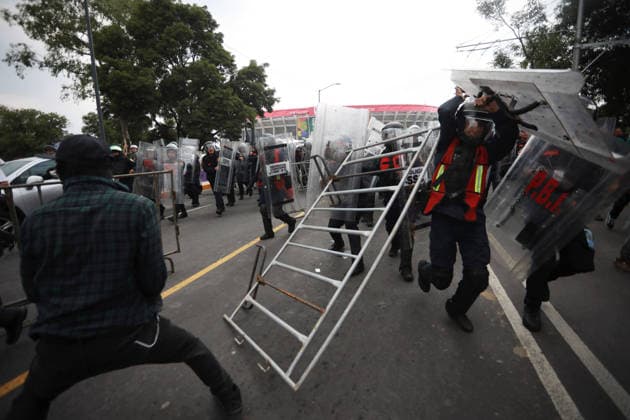 Demonstrators clash with police during the World Cup opener in Mexico City MEXICO CITY, MEXICO - JUNE 11: Demonstrators clash with riot police near Banorte Stadium during the World Cup opener, in Mexico City, Mexico on June 11, 2026. Thousands of demonstrators marched toward Banorte Stadium to protest against the World Cup, while some clashed with riot police outside the stadium where the World Cup opener was taking place. Daniel Cardenas Anadolu Mexico City Mexico. Editorial use only. Please get in touch for any other usage.  Copyright: x2026xAnadoluxDanielxCardenasx