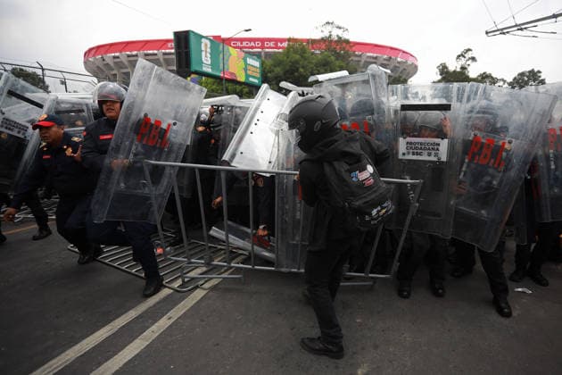 Demonstrators clash with police during the World Cup opener in Mexico City MEXICO CITY, MEXICO - JUNE 11: Demonstrators clash with riot police near Banorte Stadium during the World Cup opener, in Mexico City, Mexico on June 11, 2026. Thousands of demonstrators marched toward Banorte Stadium to protest against the World Cup, while some clashed with riot police outside the stadium where the World Cup opener was taking place. Daniel Cardenas Anadolu Mexico City Mexico. Editorial use only. Please get in touch for any other usage.  Copyright: x2026xAnadoluxDanielxCardenasx