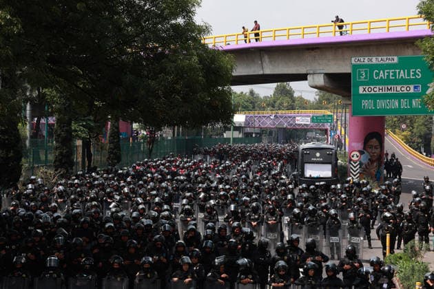 Demonstrators clash with police during the World Cup opener in Mexico City MEXICO CITY, MEXICO - JUNE 11: Riot police secure the area during a protest against the World Cup, in Mexico City, Mexico on June 11, 2026. Thousands of demonstrators marched toward Banorte Stadium to protest against the World Cup, while some clashed with riot police outside the stadium where the World Cup opener was taking place. Daniel Cardenas Anadolu Mexico City Mexico. Editorial use only. Please get in touch for any other usage.  Copyright: x2026xAnadoluxDanielxCardenasx