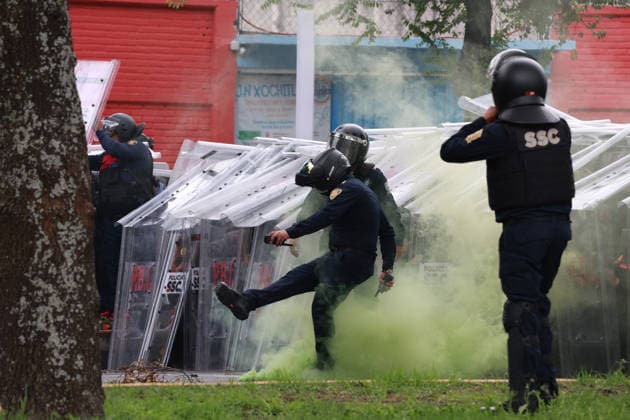 Demonstrators clash with police during the World Cup opener in Mexico City MEXICO CITY, MEXICO - JUNE 11: Riot police use shields to protect themselves during clashes with demonstrators near Banorte Stadium, in Mexico City, Mexico on June 11, 2026. Thousands of demonstrators marched toward Banorte Stadium to protest against the World Cup, while some clashed with riot police outside the stadium where the World Cup opener was taking place. Daniel Cardenas Anadolu Mexico City Mexico. Editorial use only. Please get in touch for any other usage.  Copyright: x2026xAnadoluxDanielxCardenasx
