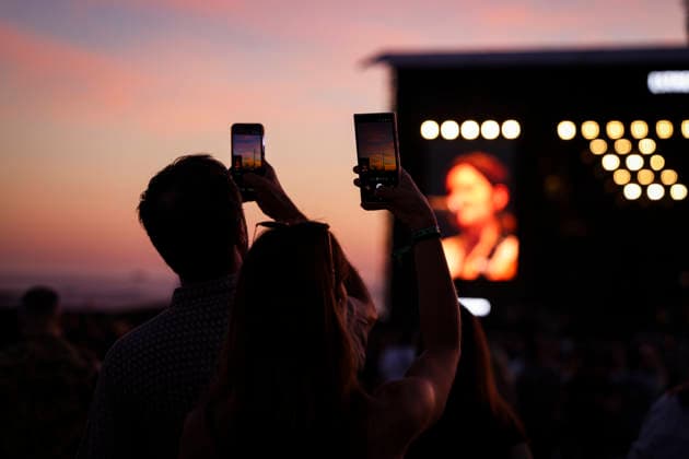 June 11, 2026, Porto, Portugal: People take photos during the concert as the sun sets on the first day of the Primavera Sound festival. Porto Portugal  - ZUMAs197 20260611_aaa_s197_095 Copyright: xRitaxFrancax