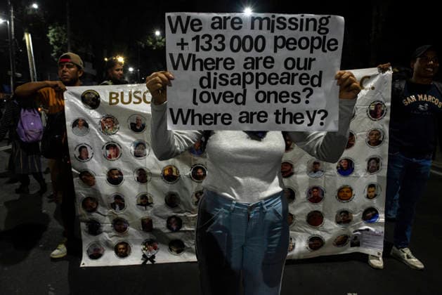 Mexico City Missing Persons March A demonstrator holds a sign reading We are missing +133 000 people in front of a banner showing missing persons during a march in Mexico City, Mexico, on June 10, 2026. The march, heading toward Estadio Azteca as part of the Let s illuminate the search event, brought together families from various Mexican states calling for justice for their missing relatives. Mexico City Mexico City Mexico Copyright: xXavierxDuartex