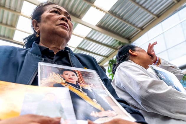 June 12, 2026, Bangkok, Bangkok, Thailand: Members of the Thai public sit and hold portraits of HRH Princess Bajrakitiyabha inside Chulalongkorn hospital while mourning her passing which took place the previous evening. Princess Bajrakitiyabha had been hospitalized since December, 2022 after suffering a cardiac episode while training her pet dog. Bangkok Thailand - ZUMAt128 20260612_zap_t128_005 Copyright: xAdryelxTalamantesx