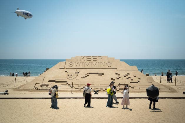 Fans gather at Haeundae Beach ahead of BTS World Tour Arirang in South Korea s Busan BUSAN, SOUTH KOREA - JUNE 12: Fans take photos and enjoy near Haeundae Beach ahead of the BTS World Tour Arirang concert at the Paradise Hotel Busan, in Busan, South Korea, on June 12, 2026. Various installations and promotional structures have been set up in the area as excitement builds for the event. Hwawon Ceci Lee Anadolu Busan South Korea. Editorial use only. Please get in touch for any other usage.  Copyright: x2026xAnadoluxHwawonxCecixLeex