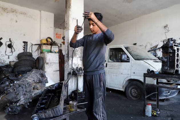 World Day Against Child Labour in Gaza GAZA CITY, GAZA, PALESTINE - JUNE 11: 12-year-old Palestinian Sami Ibrahim Hammad, who lost his father in Israeli attacks on Gaza, works long hours at an auto repair shop to support himself and his family instead of continuing his education during the World Day Against Child Labour on June 12, 2026 in Gaza City, Gaza, Palestine. Khalil Ramzi Alkahlut Anadolu Gaza City Gaza. Editorial use only. Please get in touch for any other usage.  Copyright: x2026xAnadoluxKhalilxRamzixAlkahlutx