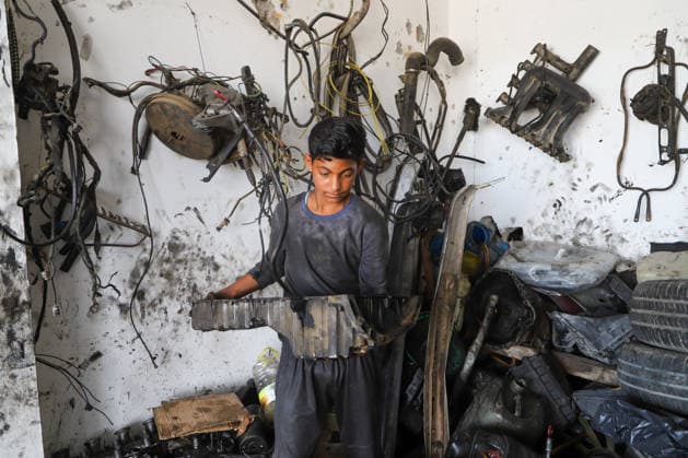 World Day Against Child Labour in Gaza GAZA CITY, GAZA, PALESTINE - JUNE 11: 12-year-old Palestinian Sami Ibrahim Hammad, who lost his father in Israeli attacks on Gaza, works long hours at an auto repair shop to support himself and his family instead of continuing his education during the World Day Against Child Labour on June 12, 2026 in Gaza City, Gaza, Palestine. Khalil Ramzi Alkahlut Anadolu Gaza City Gaza. Editorial use only. Please get in touch for any other usage.  Copyright: x2026xAnadoluxKhalilxRamzixAlkahlutx