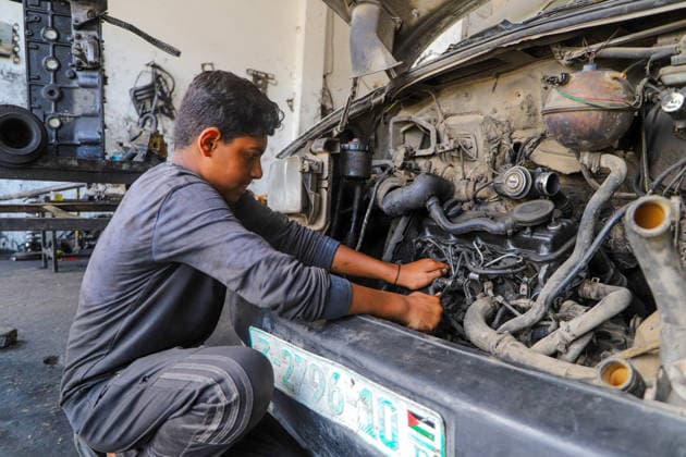 World Day Against Child Labour in Gaza GAZA CITY, GAZA, PALESTINE - JUNE 11: 12-year-old Palestinian Sami Ibrahim Hammad, who lost his father in Israeli attacks on Gaza, works long hours at an auto repair shop to support himself and his family instead of continuing his education during the World Day Against Child Labour on June 12, 2026 in Gaza City, Gaza, Palestine. Khalil Ramzi Alkahlut Anadolu Gaza City Gaza. Editorial use only. Please get in touch for any other usage.  Copyright: x2026xAnadoluxKhalilxRamzixAlkahlutx