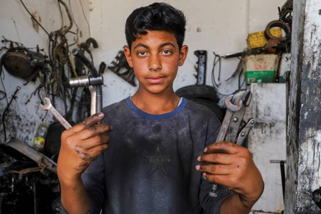 World Day Against Child Labour in Gaza GAZA CITY, GAZA, PALESTINE - JUNE 11: 12-year-old Palestinian Sami Ibrahim Hammad, who lost his father in Israeli attacks on Gaza, works long hours at an auto repair shop to support himself and his family instead of continuing his education during the World Day Against Child Labour on June 12, 2026 in Gaza City, Gaza, Palestine. Khalil Ramzi Alkahlut Anadolu Gaza City Gaza. Editorial use only. Please get in touch for any other usage.  Copyright: x2026xAnadoluxKhalilxRamzixAlkahlutx