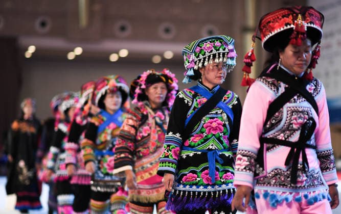 (260612) -- KUNMING, June 12, 2026 -- A team composed of local people from Yunnan Province s Chuxiong performs at the opening ceremony of a fashion week during the China-South Asia Expo in Kunming, southwest China s Yunnan Province, June 12, 2026. The fashion week kicked off here on Friday, as part of the 10th edition of the China-South Asia Expo which is held from June 11 to 16 in Kunming. ) CHINA-YUNNAN-KUNMING-CHINA-SOUTH ASIA EXPO-FASHION WEEK (CN) JiangxWenyao 