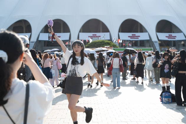 Fans gather ahead of BTS World Tour Arirang in South Korea s Busan BUSAN, SOUTH KOREA - JUNE 12: A fan poses for photos as BTS photos and characters are displayed at Jonghap Undongjang Station near Busan Asiad Main Stadium, the venue for BTS World Tour Arirang , in Busan, South Korea on June 12, 2026. Hwawon Ceci Lee Anadolu Busan South Korea. Editorial use only. Please get in touch for any other usage.  Copyright: x2026xAnadoluxHwawonxCecixLeex