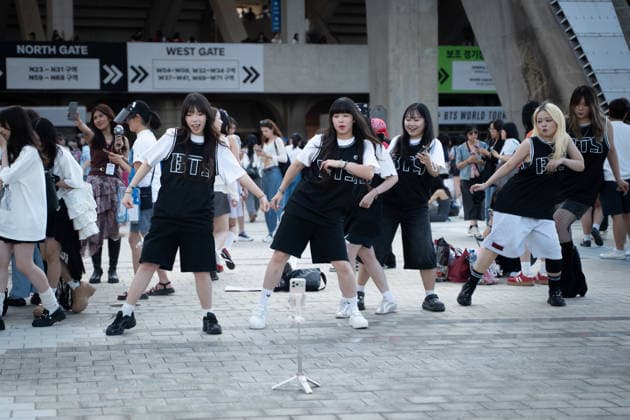 Fans gather ahead of BTS World Tour Arirang in South Korea s Busan BUSAN, SOUTH KOREA - JUNE 12: Fans are dancing and filming videos in front of Busan Asiad Main Stadium, the venue for BTS World Tour Arirang , in Busan, South Korea on June 12, 2026. Hwawon Ceci Lee Anadolu Busan South Korea. Editorial use only. Please get in touch for any other usage.  Copyright: x2026xAnadoluxHwawonxCecixLeex