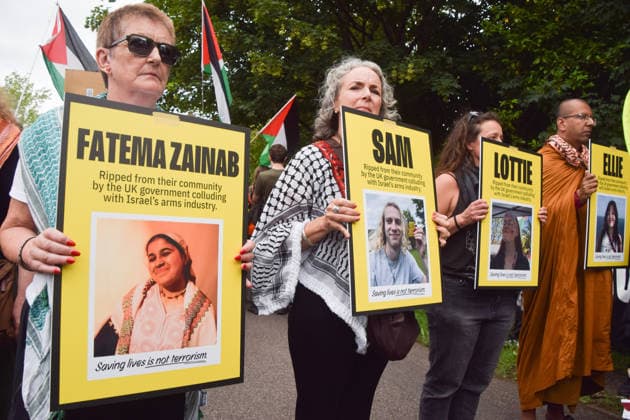 June 12, 2026, London, England, United Kingdom: Protesters hold pictures of Fatema Zainab Rajwan, Samuel Corner, Charlotte Lottie Head, and Leona Ellie Kamio outside Woolwich Crown Court during the sentencing of the activists known as the Filton 4, associated with Palestine Action. The judge will rule whether the activists will be sentenced as terrorists , following their convictions for criminal damage after a direct action at the factory of arms company Elbit Systems in Filton, close to Bristol. London United Kingdom  - ZUMAv130 20260612_zip_v130_030 Copyright: xVukxValcicx