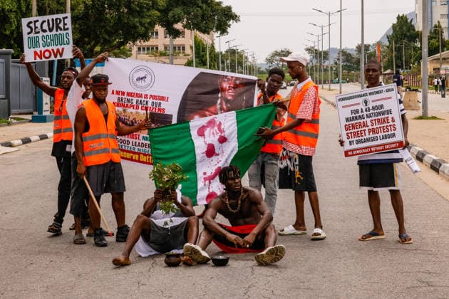 Protest held on Democracy Day over security and economic crisis in Nigeria ABUJA, NIGERIA - JUNE 12: People chanting slogans against the government and carrying banners attend a protest held on June 12 Democracy Day against rising security and economic problems in Abuja, Nigeria, on June 12, 2026. In the demonstration, which saw high participation, protesters expressed their reaction to increasing security issues in the country, mass kidnappings of students from schools, and economic hardship. Emmanuel Osodi Anadolu Abuja Nigeria. Editorial use only. Please get in touch for any other usage.  Copyright: x2026xAnadoluxEmmanuelxOsodix