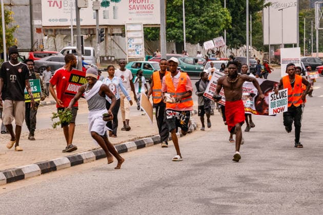 Protest held on Democracy Day over security and economic crisis in Nigeria ABUJA, NIGERIA - JUNE 12: People chanting slogans against the government and carrying banners attend a protest held on June 12 Democracy Day against rising security and economic problems in Abuja, Nigeria, on June 12, 2026. In the demonstration, which saw high participation, protesters expressed their reaction to increasing security issues in the country, mass kidnappings of students from schools, and economic hardship. Emmanuel Osodi Anadolu Abuja Nigeria. Editorial use only. Please get in touch for any other usage.  Copyright: x2026xAnadoluxEmmanuelxOsodix