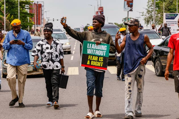 Protest held on Democracy Day over security and economic crisis in Nigeria ABUJA, NIGERIA - JUNE 12: People chanting slogans against the government and carrying banners attend a protest held on June 12 Democracy Day against rising security and economic problems in Abuja, Nigeria, on June 12, 2026. In the demonstration, which saw high participation, protesters expressed their reaction to increasing security issues in the country, mass kidnappings of students from schools, and economic hardship. Emmanuel Osodi Anadolu Abuja Nigeria. Editorial use only. Please get in touch for any other usage.  Copyright: x2026xAnadoluxEmmanuelxOsodix