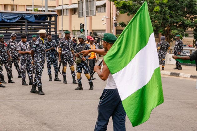 Protest held on Democracy Day over security and economic crisis in Nigeria ABUJA, NIGERIA - JUNE 12: Security measures are taken by closing a main road as people chanting slogans against the government and carrying banners attend a protest held on June 12 Democracy Day against rising security and economic problems in Abuja, Nigeria, on June 12, 2026. Emmanuel Osodi Anadolu Abuja Nigeria. Editorial use only. Please get in touch for any other usage.  Copyright: x2026xAnadoluxEmmanuelxOsodix