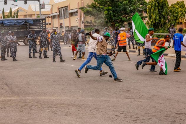 Protest held on Democracy Day over security and economic crisis in Nigeria ABUJA, NIGERIA - JUNE 12: Security measures are taken by closing a main road as people chanting slogans against the government and carrying banners attend a protest held on June 12 Democracy Day against rising security and economic problems in Abuja, Nigeria, on June 12, 2026. Emmanuel Osodi Anadolu Abuja Nigeria. Editorial use only. Please get in touch for any other usage.  Copyright: x2026xAnadoluxEmmanuelxOsodix