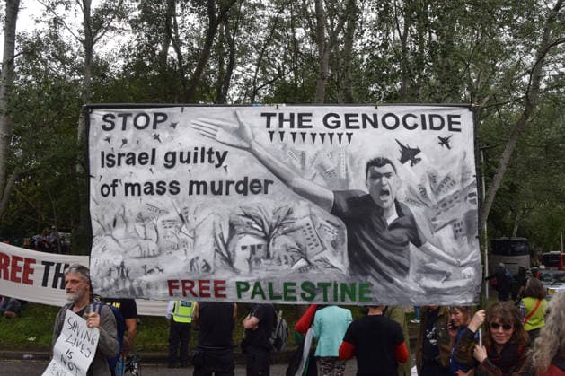 June 12, 2026, London, England, United Kingdom: A Stop the genocide banner hangs outside Woolwich Crown Court during the sentencing of the activists known as the Filton 4, associated with Palestine Action. The judge will rule whether the activists will be sentenced as terrorists , following their convictions for criminal damage after a direct action at the factory of arms company Elbit Systems in Filton, close to Bristol. London United Kingdom - ZUMAv130 20260612_zip_v130_041 Copyright: xVukxValcicx