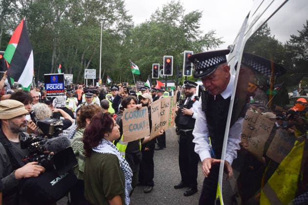 June 12, 2026, London, England, United Kingdom: Protesters confront police officers outside Woolwich Crown Court during the sentencing of the activists known as the Filton 4, associated with Palestine Action. The judge will rule whether the activists will be sentenced as terrorists , following their convictions for criminal damage after a direct action at the factory of arms company Elbit Systems in Filton, close to Bristol. London United Kingdom - ZUMAv130 20260612_zip_v130_051 Copyright: xVukxValcicx